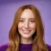 headshot-charming-attractive-happy-young-redhead-woman-with-freckles-bright-white-smile-grinning-satisfied-camera-as-posing-purple-background-friendly-delighted
